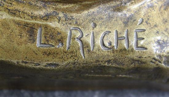 L. Riche. A gold patinated bronze model of a seated Alsatian, 21in.